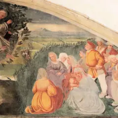 Der heilige Antonius predigt von einem Baum herab einer Gruppe von Menschen.