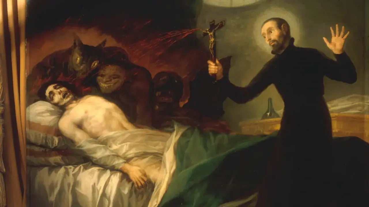 Ein Priester hält ein Kruzifix, um Dämonen von einem kranken Mann fernzuhalten. Dies zeigt, was ist Exorzismus: ein Kampf gegen das Böse.